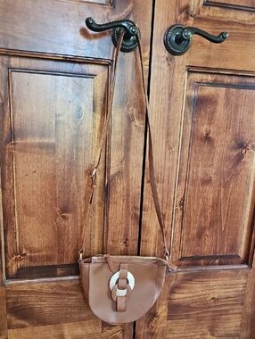 Brown Crossbody Saddle Bag with Decorative Ring
